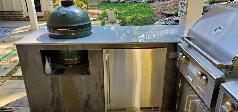Patio kitchen - small contemporary backyard concrete patio kitchen idea in Other with a roof extension