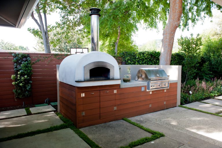 Patio kitchen - small contemporary backyard concrete paver patio kitchen idea in Los Angeles with no cover
