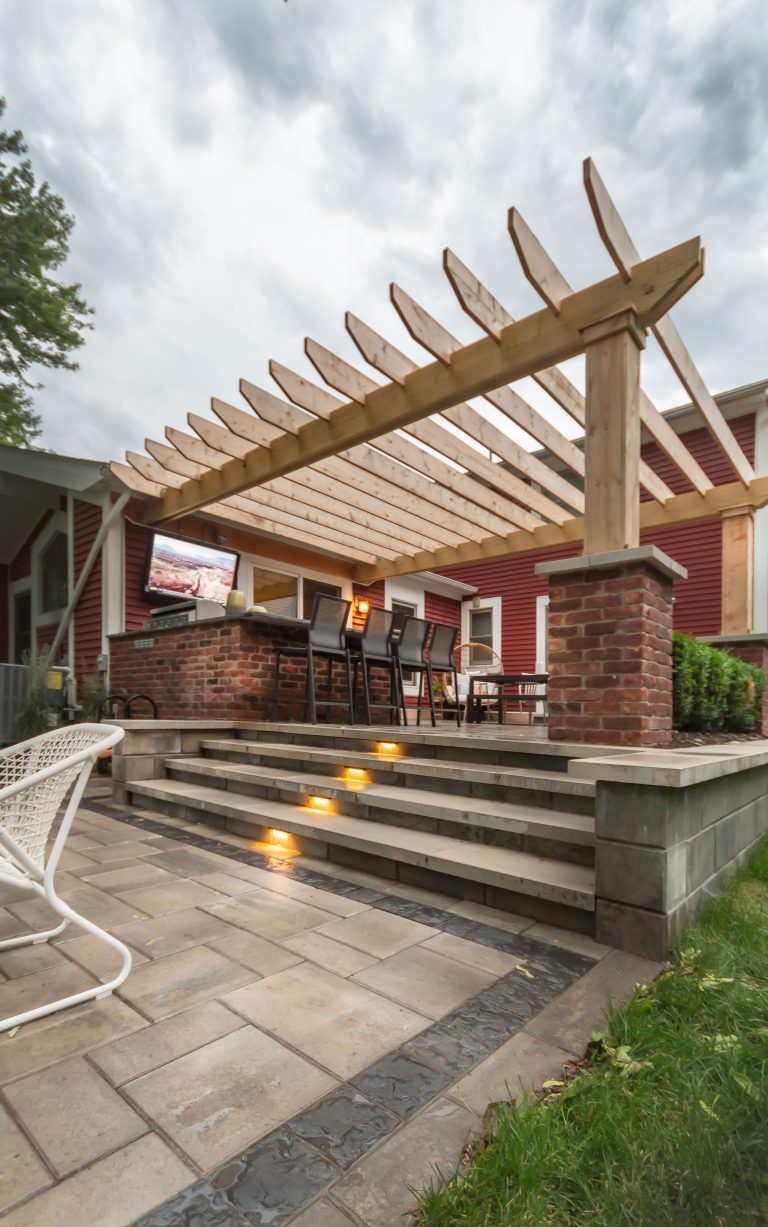 Patio kitchen - small craftsman backyard brick patio kitchen idea in Detroit with a pergola