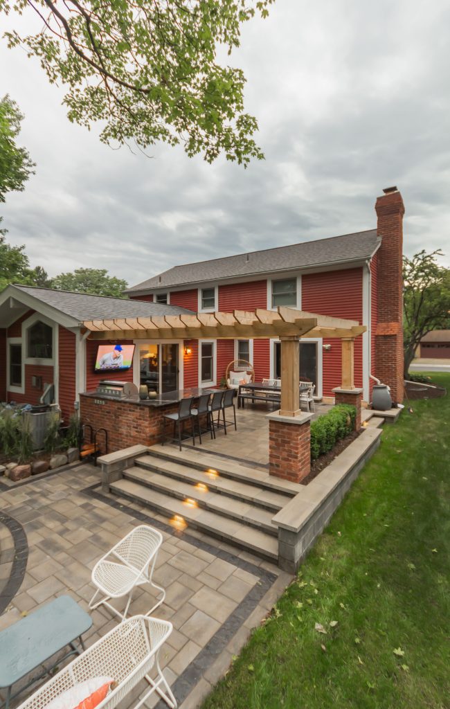 Patio kitchen - small craftsman backyard brick patio kitchen idea in Detroit with a pergola
