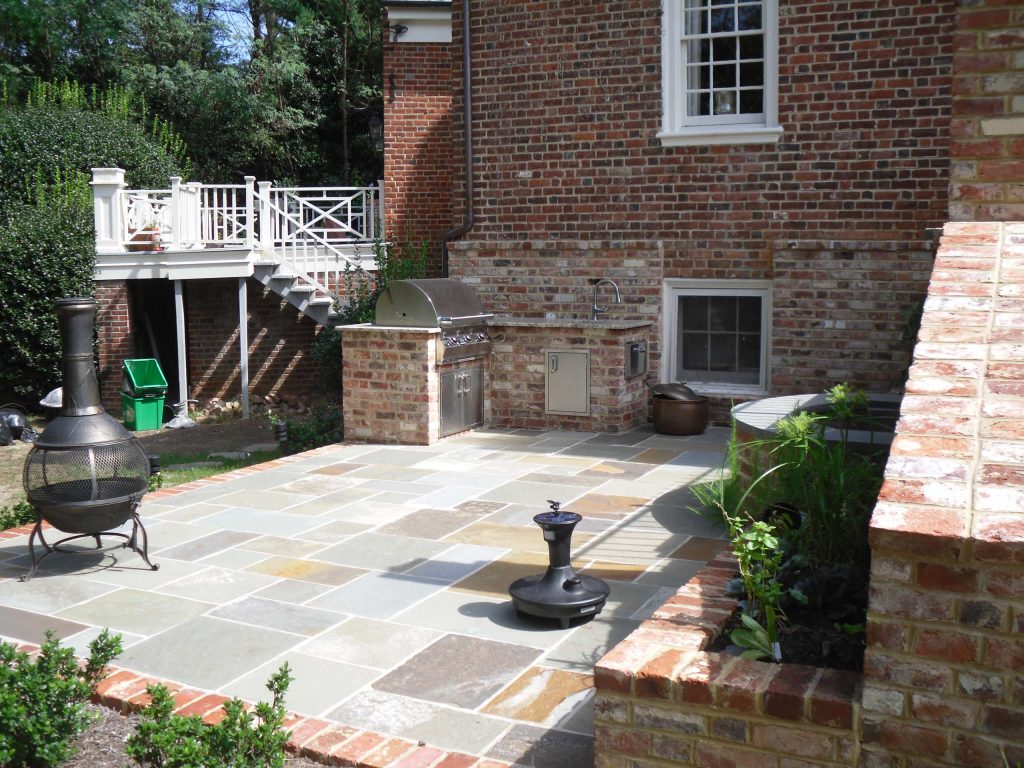 Patio kitchen - small traditional backyard stone patio kitchen idea in Richmond with no cover