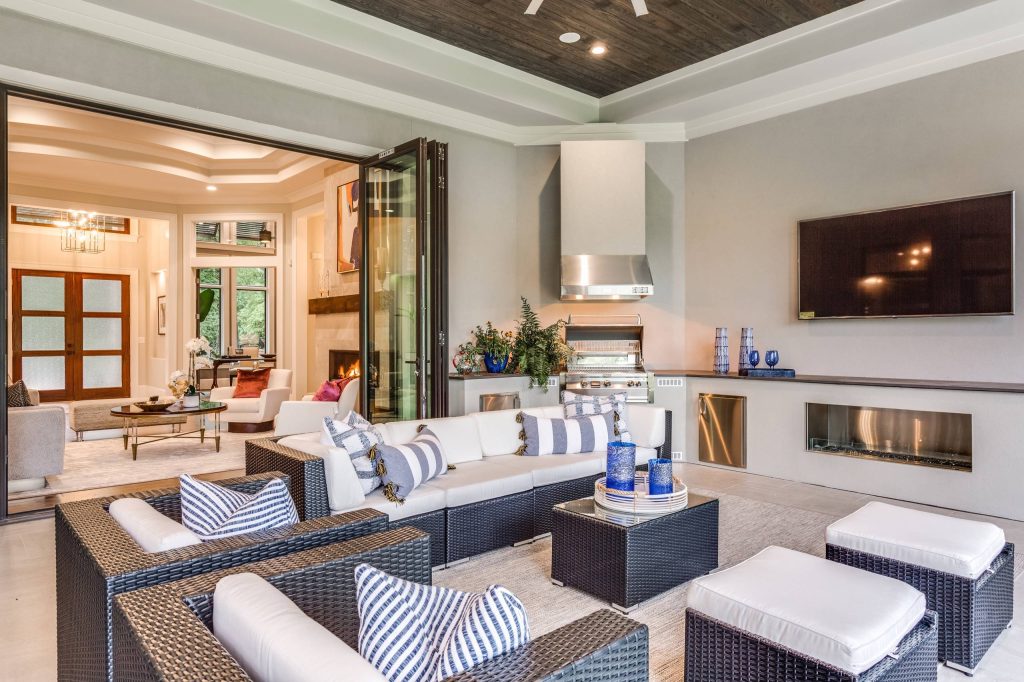 Patio kitchen - transitional backyard patio kitchen idea in Other with a roof extension