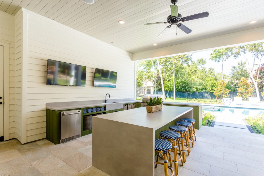 Patio kitchen - transitional backyard tile patio kitchen idea in Houston with a roof extension