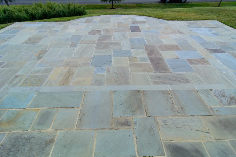 Photo by Matchbook Productions - front yard; entry way; variegated blue flagstone; walkway with step and curved design - improved curb appeal; had to match existing house entrance flagstone with new front patio