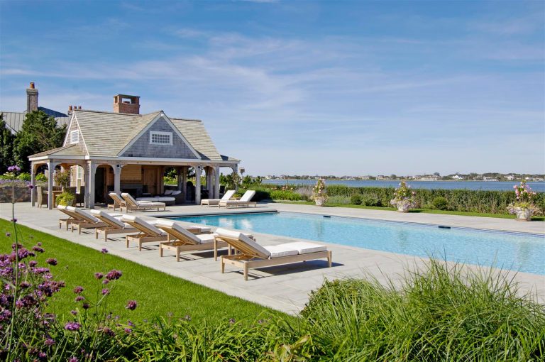 This luxury Hamptons pool house features a flat screen television and scenic bay views.

View more Hamptons pools and cabanas on our website at: http://hamptonshabitat.com/featured-rooms-areas/hamptons-pools-and-cabanas/

Photo by Ron Papageorge by Hamptons Habitat Enterprises Corp. | Pool design | Pool Contracting | Swimming Pool Ideas | Swimming Pool Design Ideas