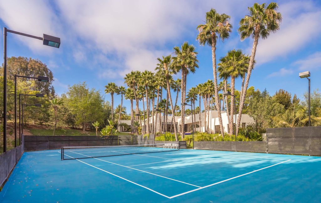 Photo of a huge contemporary partial sun backyard outdoor sport court in San Diego.