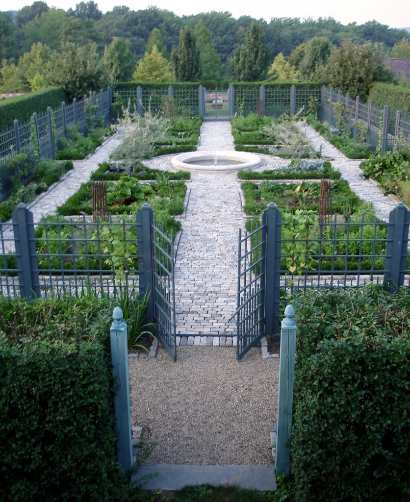 Photo of a large farmhouse backyard stone landscaping in New York.
