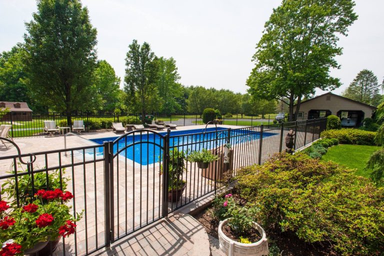 Photo of a large traditional backyard concrete paver landscaping in Philadelphia.