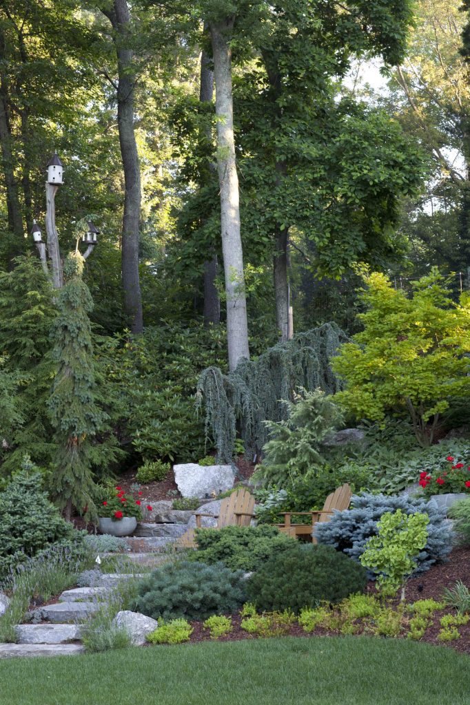 Photo of a large traditional partial sun backyard gravel formal garden in New York.