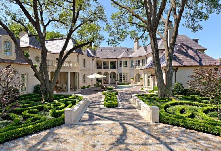 Photo of a mediterranean full sun backyard brick landscaping in Dallas.