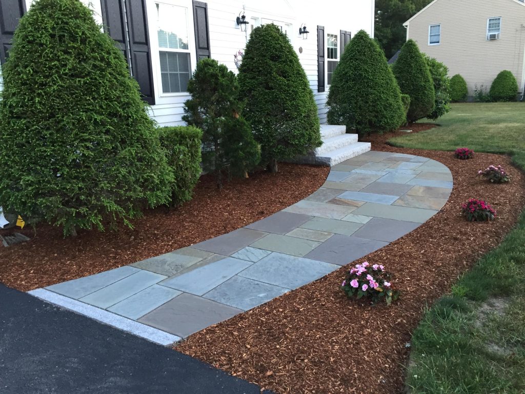 Photo of a mid-sized traditional front yard stone landscaping in Boston. by Natural Path Landscaping | Outdoor Photos | Porch | Landscaping | Landscape Design | Outdoor Living Space | Porch Design Ideas | Outdoor Living Space Ideas | Backyard Design