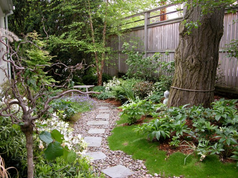 Photo of a mid-sized asian full sun backyard stone garden path in Boston for spring.