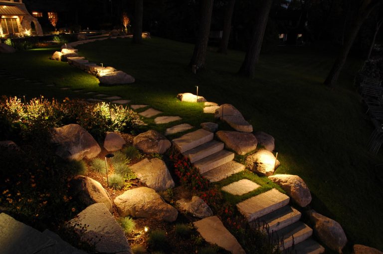 Photo of a mid-sized traditional partial sun backyard stone landscaping in Minneapolis for spring.