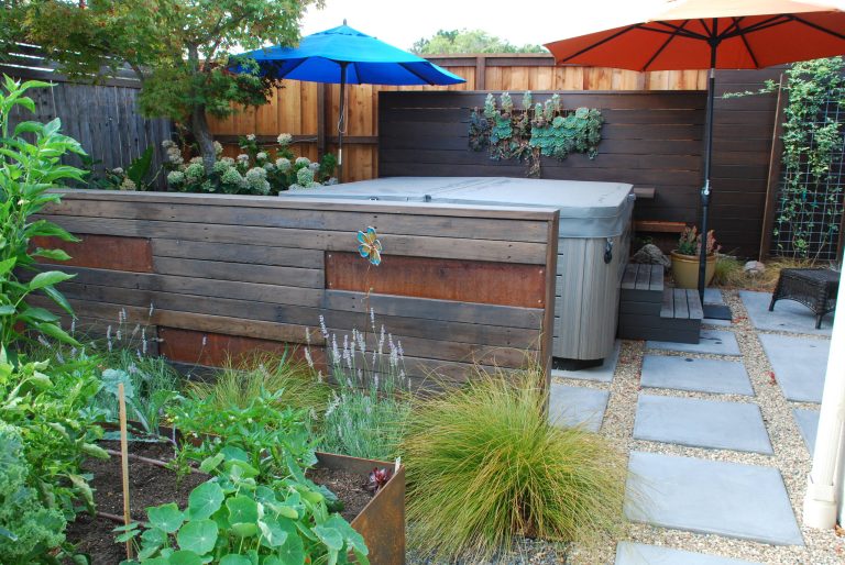 Photo of a small contemporary drought-tolerant and full sun backyard concrete paver landscaping in San Francisco.