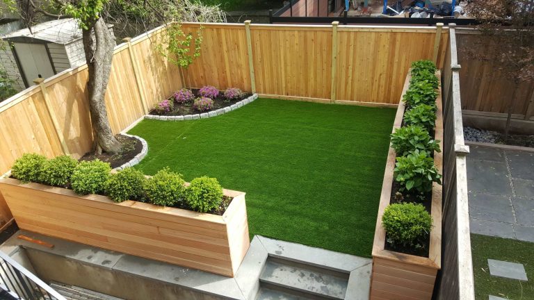 Photo of a small traditional partial sun backyard landscaping in New York.