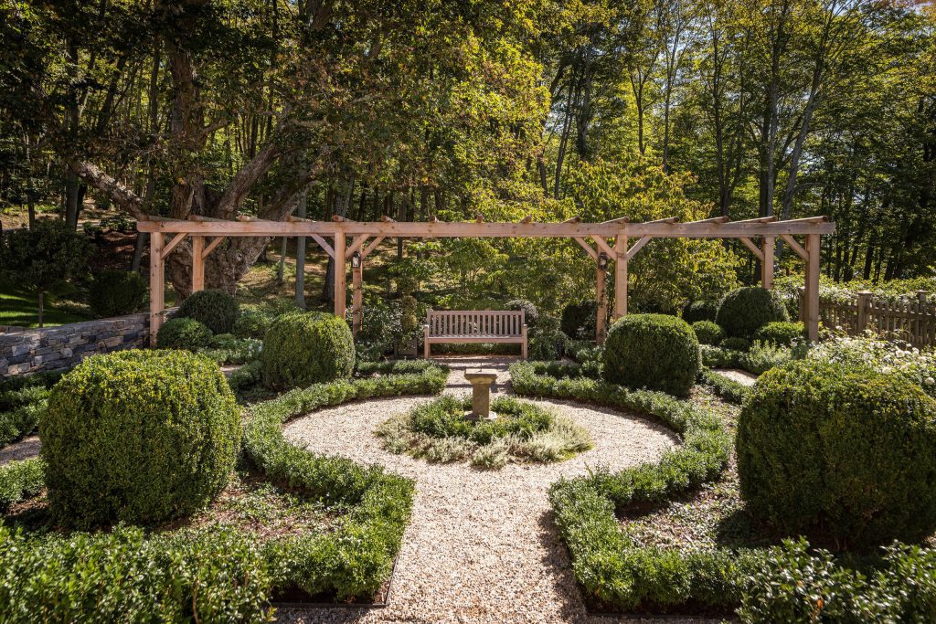 Photo of a traditional backyard gravel landscaping in New York with a pergola.