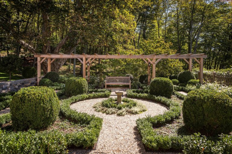 Photo of a traditional backyard gravel landscaping in New York with a pergola.