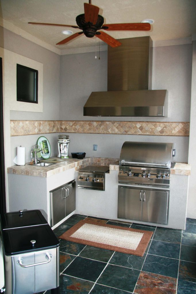 Photo taken to show L-shape outdoor kitchen