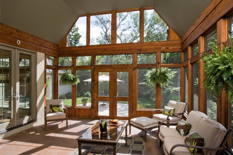 Photography by Linda Oyama Bryan. http://pickellbuilders.com. Stained Cedar Timber Screened Porch with Stained Concrete Floor and French Doors to paver terrace. by Orren Pickell Building Group | Outdoor Photos | Porch | Landscaping | Landscape Design | Outdoor Living Space | Porch Design Ideas | Outdoor Living Space Ideas | Backyard Design