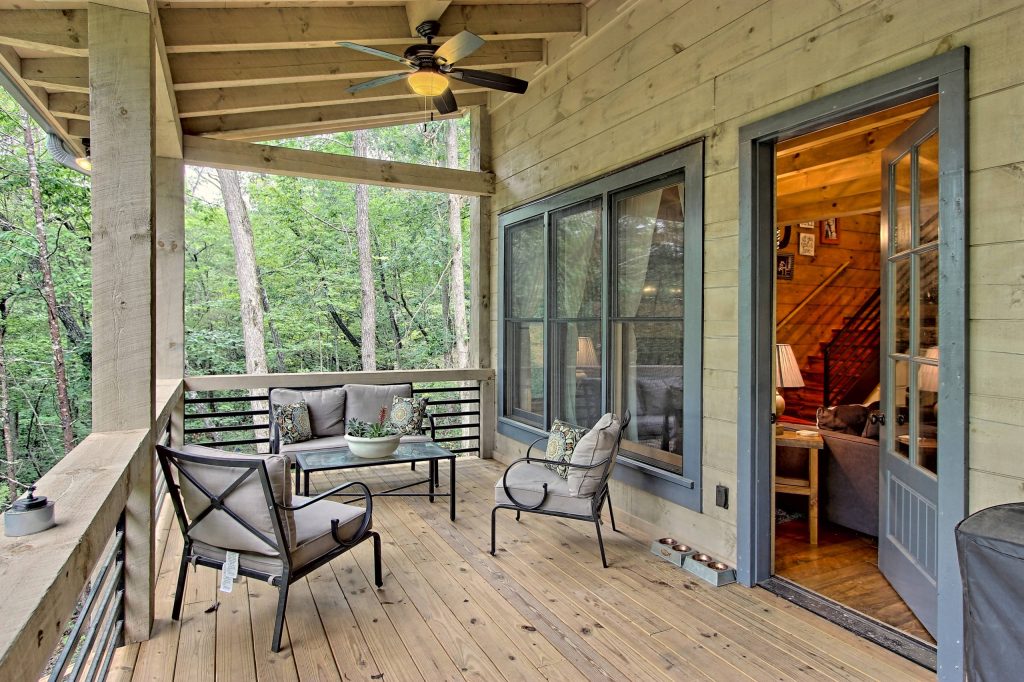 Photos by Kurtis Miller Photography, kmpics.com Cozy porch with beamed roof. Gray on Gray.