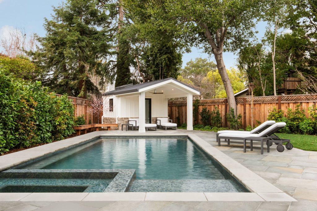 Pool and Poolhouse utilize the extended depth of a pie-shape in the lot. Sun and shade areas are both provided.