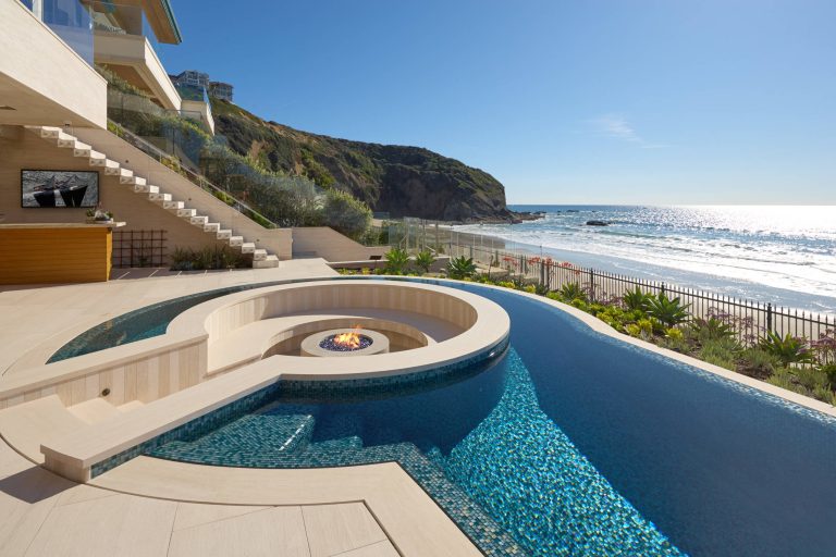 Pool - contemporary backyard tile and custom-shaped pool idea in Los Angeles