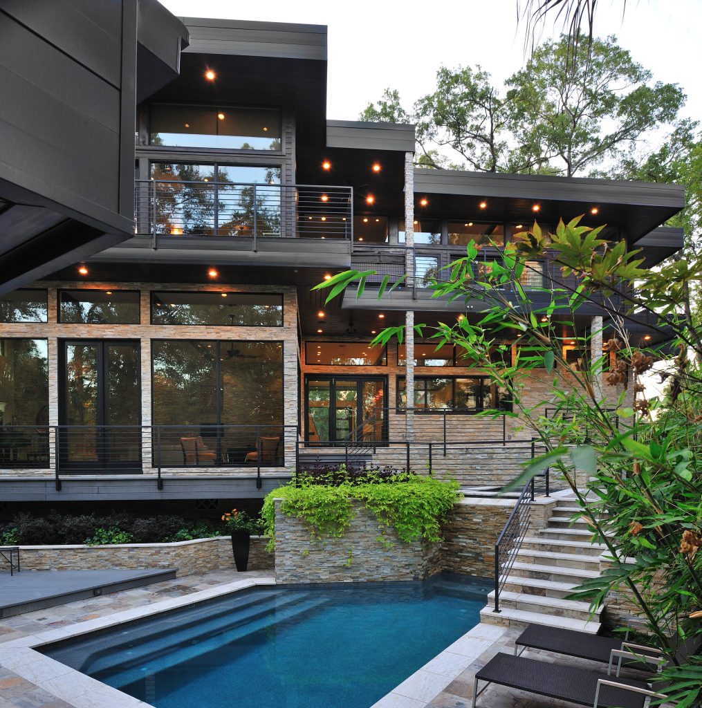 Pool - contemporary custom-shaped pool idea in Houston