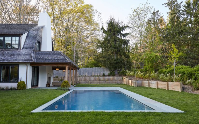 Pool - farmhouse backyard rectangular lap pool idea in New York