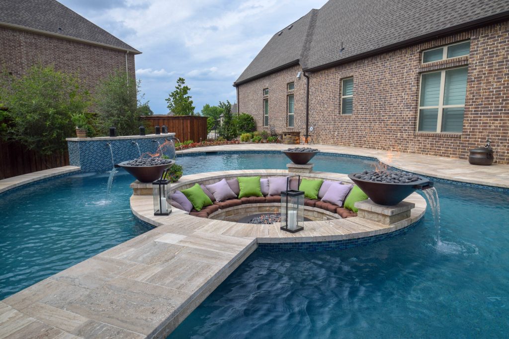 Pool fountain - contemporary tile and custom-shaped pool fountain idea in Dallas