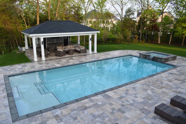 Pool fountain - large contemporary backyard stone and rectangular lap pool fountain idea in DC Metro
