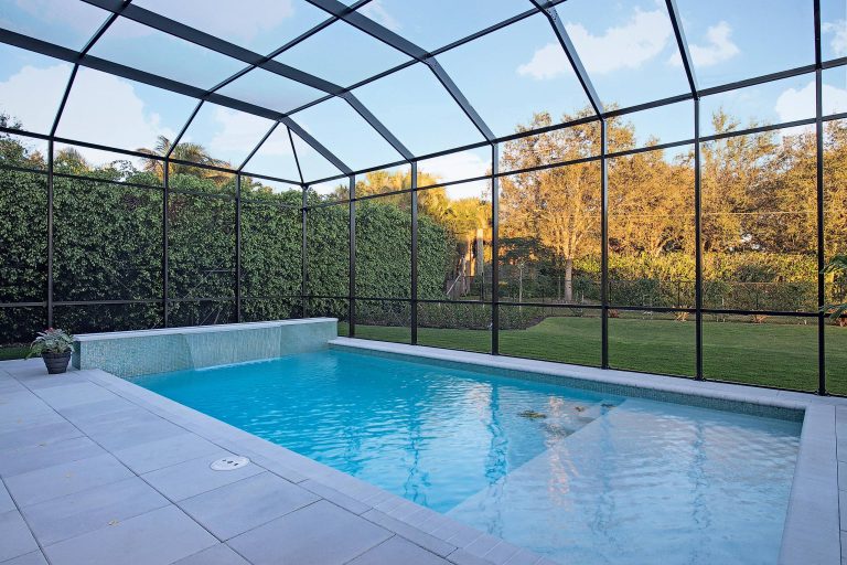 Pool fountain - large tropical backyard concrete paver and rectangular pool fountain idea in Miami