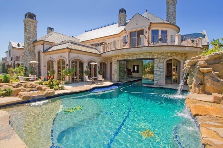 Pool fountain - mediterranean custom-shaped pool fountain idea in Los Angeles