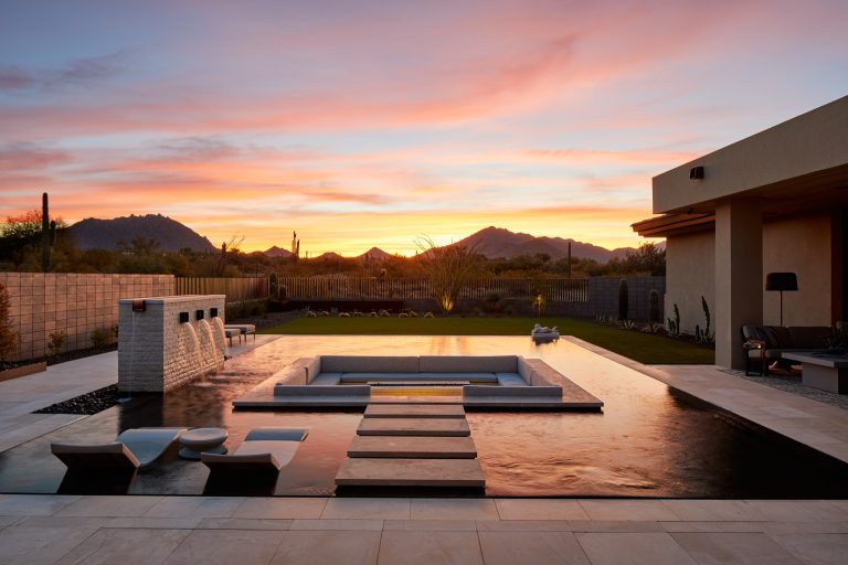 Pool fountain - mid-sized backyard tile and rectangular infinity pool fountain idea in Phoenix