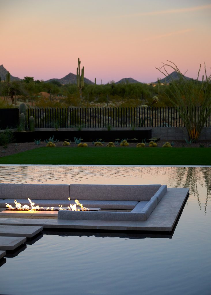Pool fountain - mid-sized backyard tile and rectangular infinity pool fountain idea in Phoenix