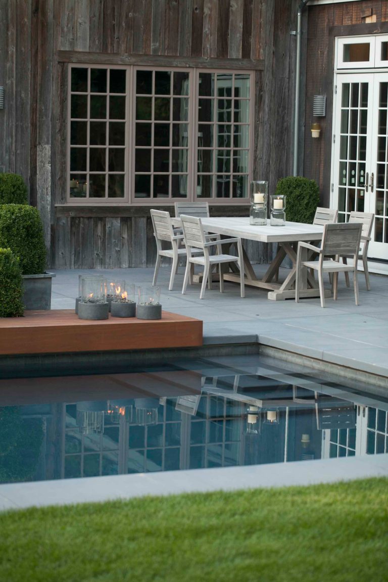 Pool fountain - mid-sized contemporary backyard concrete and rectangular lap pool fountain idea in New York