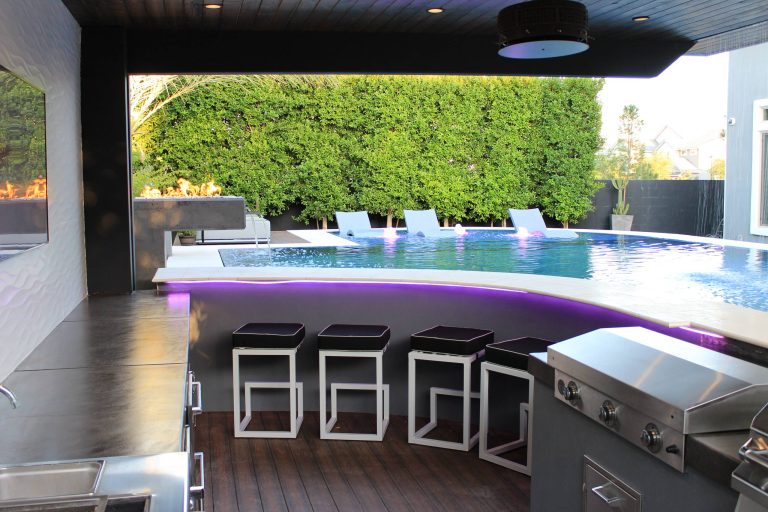 Pool fountain - mid-sized contemporary backyard custom-shaped aboveground pool fountain idea in Phoenix with decking