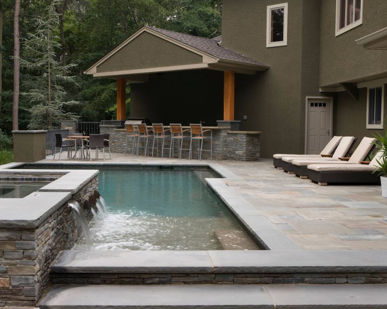 Pool fountain - mid-sized contemporary backyard tile and rectangular lap pool fountain idea in Philadelphia