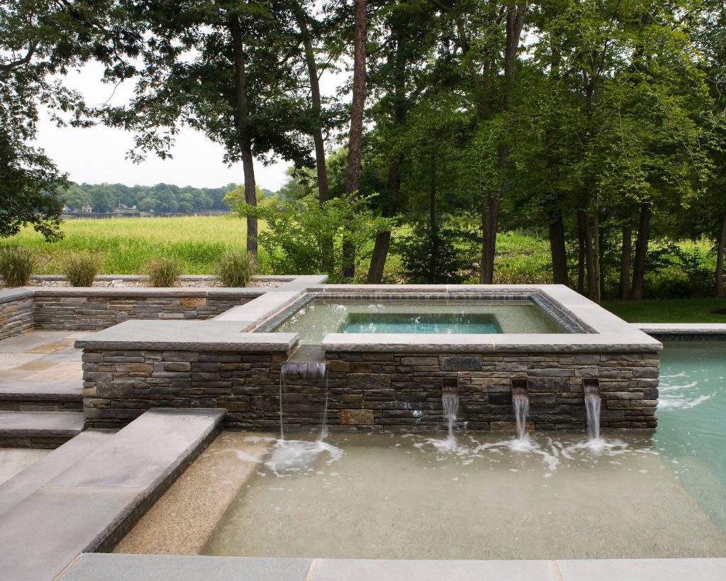 Pool fountain - mid-sized contemporary backyard tile and rectangular lap pool fountain idea in Philadelphia