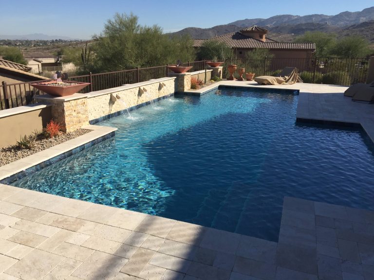 Pool fountain - mid-sized transitional backyard stone and custom-shaped lap pool fountain idea in Phoenix