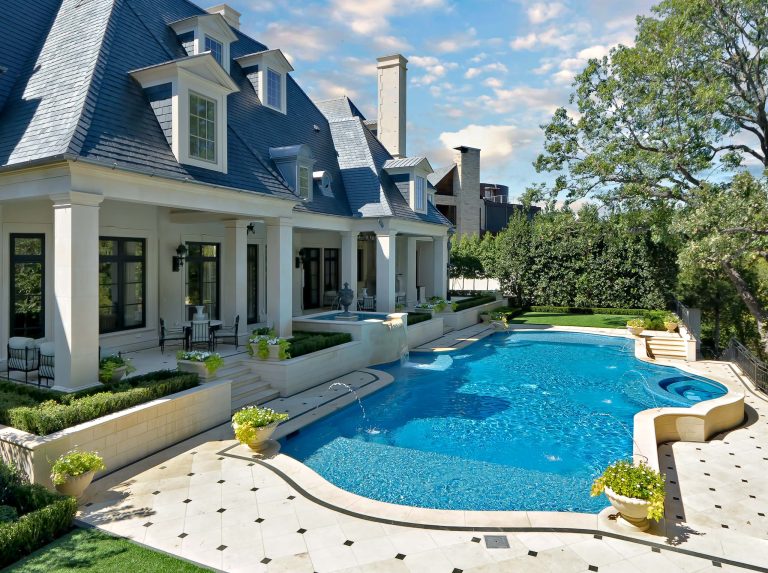 Pool fountain - traditional custom-shaped pool fountain idea in Dallas