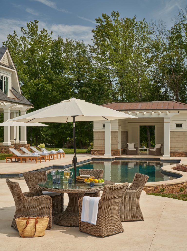 Pool house - backyard custom-shaped pool house idea in Charlotte