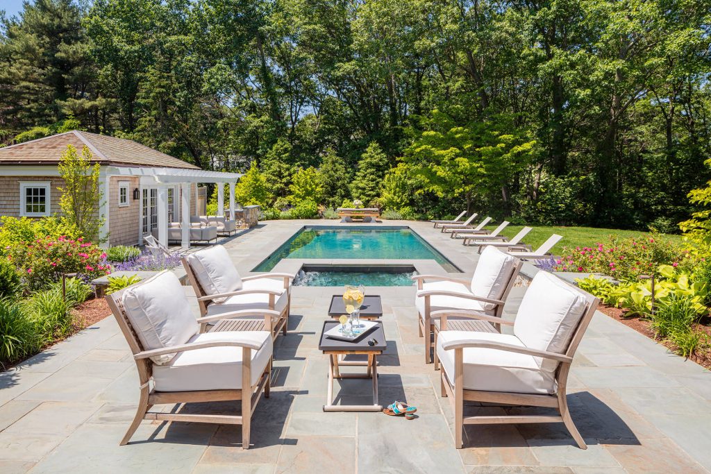 Pool house - coastal backyard pool house idea in Boston