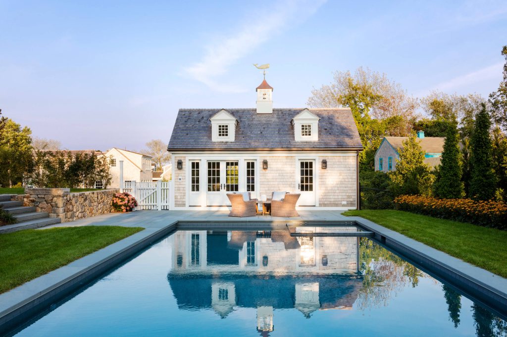 Pool house - coastal backyard rectangular pool house idea in Providence