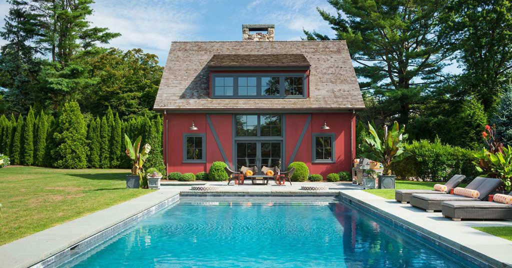 Pool house - farmhouse backyard concrete and rectangular pool house idea in New York