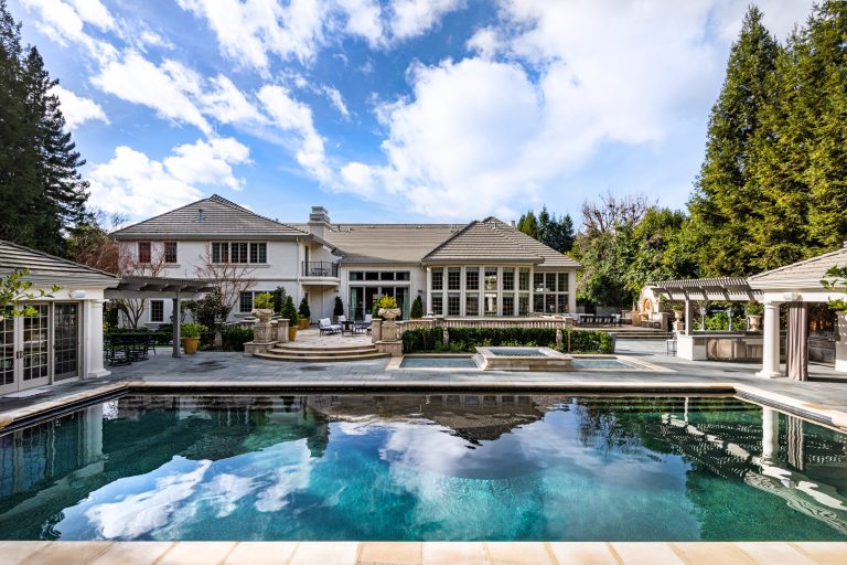 Pool house - french country backyard tile and rectangular pool house idea in San Francisco