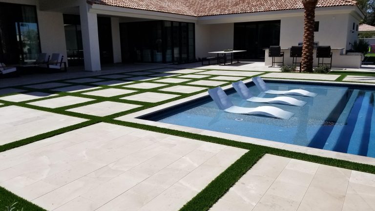 Pool house - large contemporary backyard stone and rectangular lap pool house idea in Phoenix
