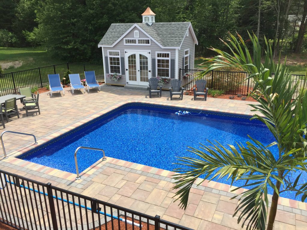 Pool house - large transitional backyard concrete paver and l-shaped natural pool house idea in Boston