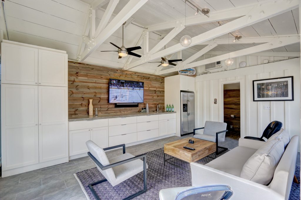 Pool house - large transitional backyard pool house idea in Oklahoma City