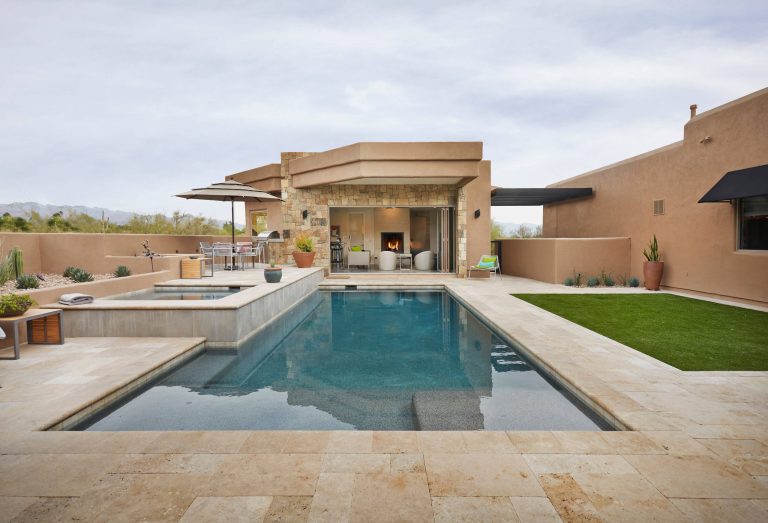 Pool house - southwestern backyard tile and rectangular lap pool house idea in Phoenix