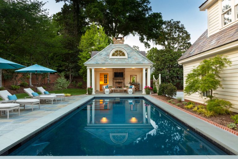 Pool house - traditional backyard tile and rectangular lap pool house idea in Charlotte